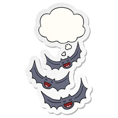 cartoon vampire bats and thought bubble as a printed sticker