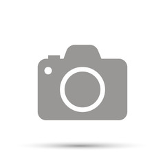 Gray camera icon on white background. Shadwo down.