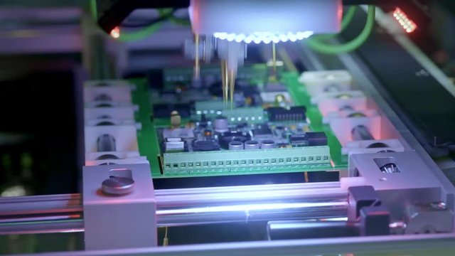 Electronic circuit board production. Automated Circut Board machine Produces Printed digital electronic board. Electronics contract manufacturing. Manufacture of electronic chips. High-tech.