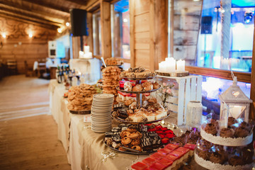 Wedding cake table background. Sweet and delicious restaurant desserts.