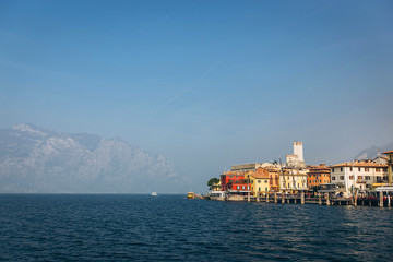 Beautiful panorama of Lake Garda Italy. View of the beautiful Lake Garda from a boat surrounded by mountains