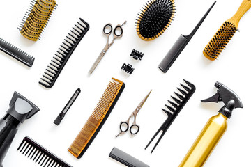 Hairdresser equipment for cutting hair and styling with combs, sciccors, brushes on white background top view pattern