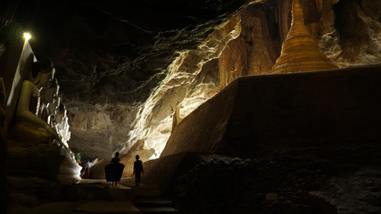 Yathaypyan Cave with golden Buddha statues near Hpa-An, Myanmar / Burma.