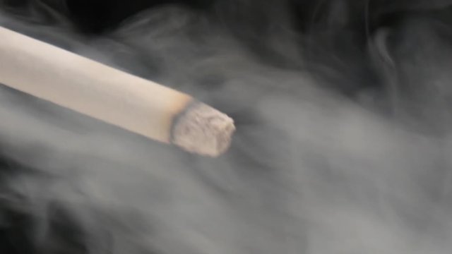 Smoking tobacco on a black background