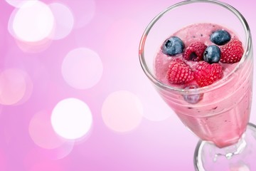 Glass of blueberry smoothie isolated on white background
