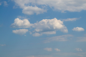 Blue sky with white air and lush clouds