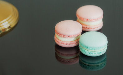 Close up colorful macarons dessert with vintage pastel tones