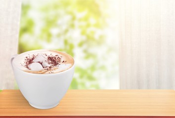 Coffee with marshmallows on white background