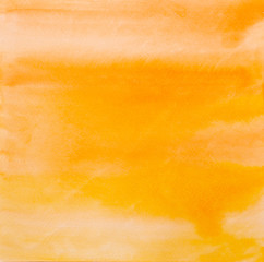 Trend photo on the theme of fashionable orange hue this season. Bright smear of watercolor paint on a white paper background.