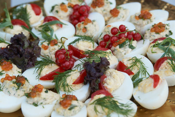 Stuffed eggs canapes with soft cheese chive and caviar