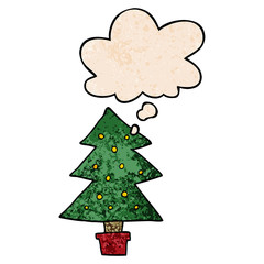 cartoon christmas tree and thought bubble in grunge texture pattern style