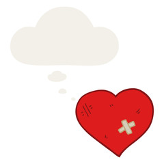 cartoon love heart with sticking plaster and thought bubble in retro style