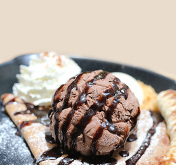 ice cream on the waffle and wipping cream