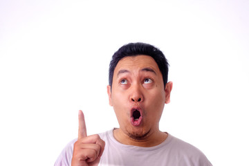 Young Man Thinking and Looking Up, Having Good Idea, with Mouth Open