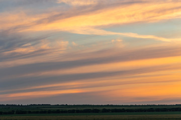Landscape with bloody sunset. The terrain in southern Europe. Tragic gloomy sky. Purple-magenta clouds.