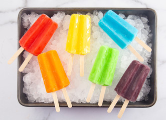 Rainbow Two Stick Popsicles in a a Box of Ice