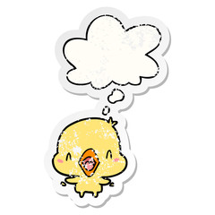 cartoon happy bird and thought bubble as a distressed worn sticker