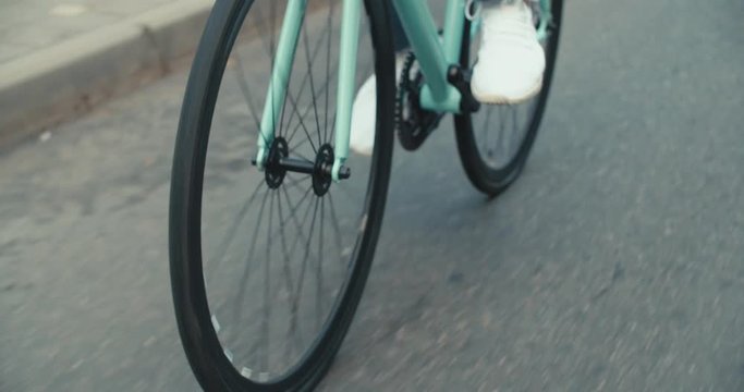 Cyclist man riding fixed gear sport bike