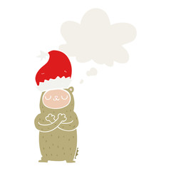 cartoon bear wearing christmas hat and thought bubble in retro style