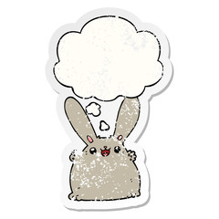 cartoon rabbit and thought bubble as a distressed worn sticker