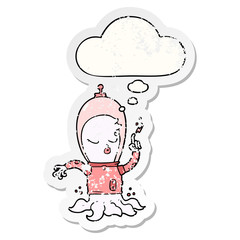 cute cartoon alien and thought bubble as a distressed worn sticker