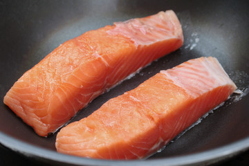 Ready raw fresh salmon for cooking in pan.