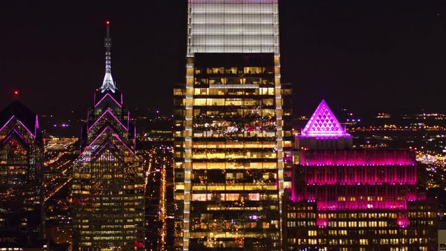 Philadelphia Pennsylvania Aerial v112 High panoramic cityscape with downtown skyscrapers in forefront at night - October 2017