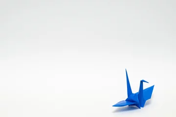 Fotobehang Kraanvogels blue origami paper crane on white background  © Akira Ito