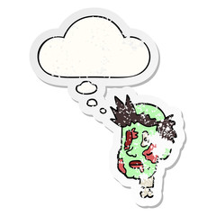 cartoon zombie head and thought bubble as a distressed worn sticker