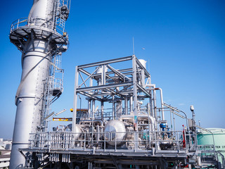 Fototapeta na wymiar Heat recovery steam generator and sky in Combined-Cycle Co-Generation Power Plant which it so beautiful and popular to background power plant concept.