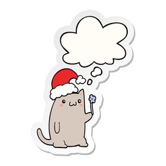 cute cartoon christmas cat and thought bubble as a printed sticker