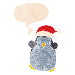 cute christmas penguin and speech bubble in retro textured style