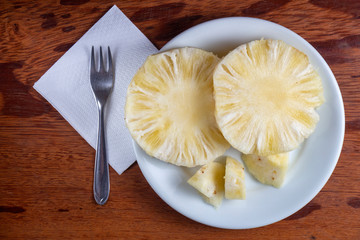 Naklejka na ściany i meble a plate with slices of pineapple