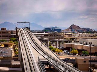 The airport in Phoenix, Arizona has a unique parking structure in that it is layers of circular...