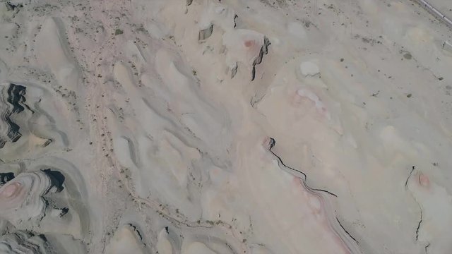 Aerial view of sandy rocks desert in the World Town of Demons of Karamay, The Haunt of Demons desert is in the  Northwest China's Xinjiang Uyghur Autonomous Region. Dusty and arid land desert