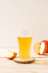 Apple juice with red apples fruits