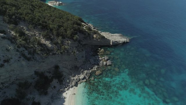 Hidden place of sardinia italy, showing mountain edge into ocean landscape and turquoise water beautiful nature of Ziu Santoru - Revealing Aerial shot