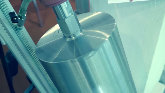 New professional stationary perforator with drill with a diamond-tipped nozzle for breaking through large holes in concrete. A new sample is presented for review at the exhibition. Shot in motion