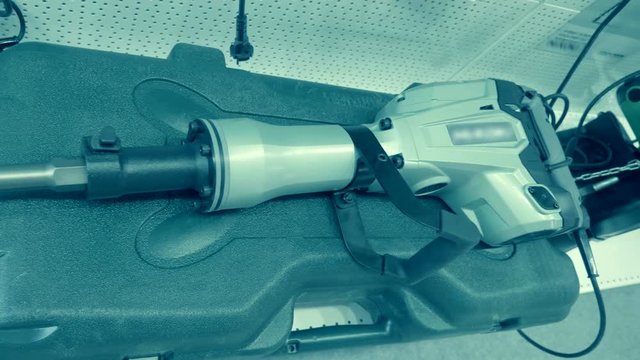 New professional powerful perforator with bit for breaking concrete. A new sample is presented for review at the exhibition. Shot in motion