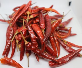 Heap of Red Chilli Pepper Powder Also Know as Mirchi, Mirchi Powder, Lal Mirchi, Mirch or Laal Mirchi isolated on White Background