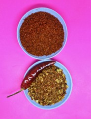 Chilly Powder in wooden bowl and dry Chilly