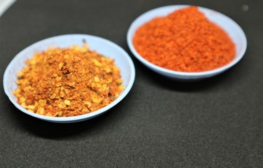 Chilly Powder in wooden bowl and dry Chilly