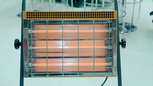 New household infrared heater presented for review at the exhibition. Shot in motion