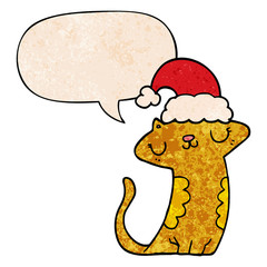 cute cartoon cat wearing christmas hat and speech bubble in retro texture style