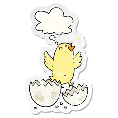 cartoon bird hatching from egg and thought bubble as a distressed worn sticker