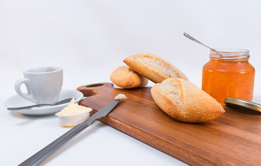 Wooden board with tasty breakfast toasts on white background
