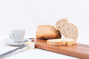 Simple breakfast, Toast and butter, loaf of bread on white background