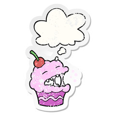 cartoon cupcake and thought bubble as a distressed worn sticker