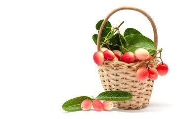 Karanda, Carunda or Christ's thorn fruits with leaf in basket isolated on white background.
