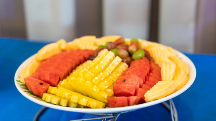 A variety of fruits on the table, blurred backgrounds at parties